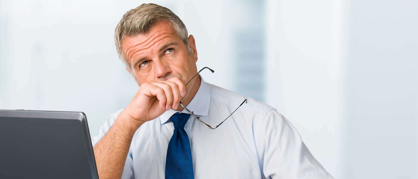 Executive thinking about signing lease Executive thinking about signing lease