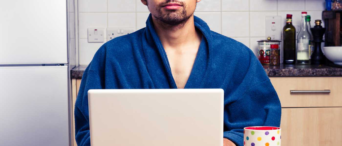 Man in Robe Working From Home Man in Robe Working From Home